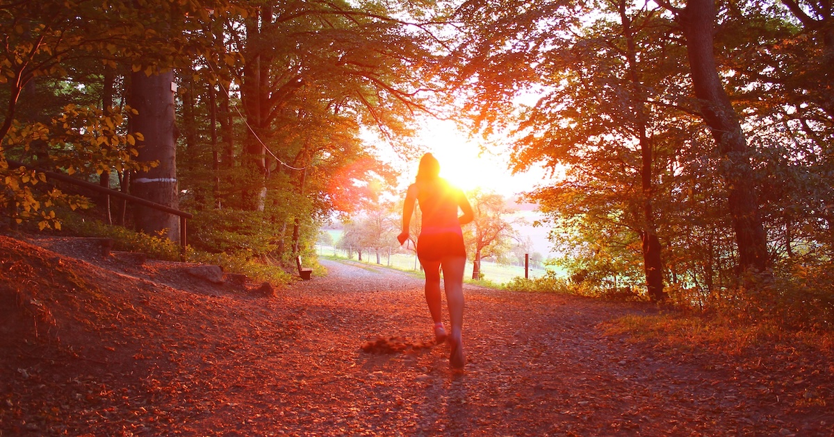 Man running towards mountains
